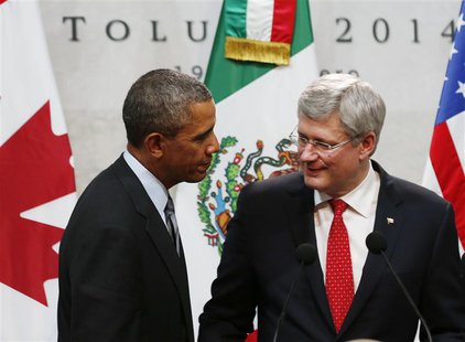 U.S. President Barack Obama joins Canada's Prime Minister Stephen Harper (R) before a trilateral meeting in the Courtyard of the Palacio de U.S. President Barack Obama joins Canada's Prime Minister Stephen Harper (R) before a trilateral meeting in the Courtyard of the Palacio de