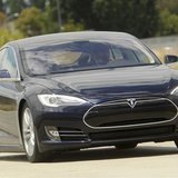 A Tesla Model S electric sedan is driven near the company's factory in Fremont, California, June 22, 2012. Tesla began delivering the electr A Tesla Model S electric sedan is driven near the company's factory in Fremont, California, June 22, 2012. Tesla began delivering the electr