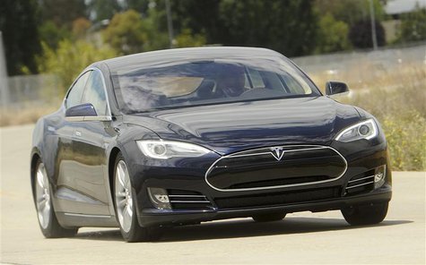 A Tesla Model S electric sedan is driven near the company's factory in Fremont, California, June 22, 2012. Tesla began delivering the electr A Tesla Model S electric sedan is driven near the company's factory in Fremont, California, June 22, 2012. Tesla began delivering the electr