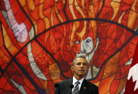 U.S. President Barack Obama joins Mexico's President Enrique Pena Nieto (unseen) and Canada's Prime Minister Stephen Harper (unseen) for a n U.S. President Barack Obama joins Mexico's President Enrique Pena Nieto (unseen) and Canada's Prime Minister Stephen Harper (unseen) for a n