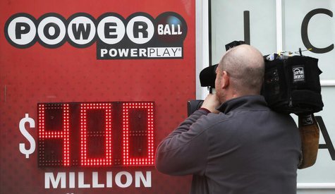 A TV cameraman films a sign for Virginia's $400 million Powerball lottery in Arlington, Virginia February 19, 2014. The drawing takes place A TV cameraman films a sign for Virginia's $400 million Powerball lottery in Arlington, Virginia February 19, 2014. The drawing takes place