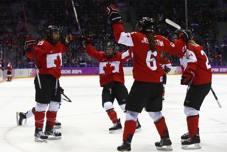 Canada's Brianne Jenner (L) celebrates her goal against Team USA with teammates Catherine Ward, Rebecca Johnston (6) and Haley Irwin (R) dur Canada's Brianne Jenner (L) celebrates her goal against Team USA with teammates Catherine Ward, Rebecca Johnston (6) and Haley Irwin (R) dur