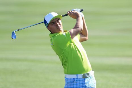 Feb 20, 2014; Marana, AZ, USA; Rickie Fowler plays from the rough of the second hole during the second round of the World Golf Championships Feb 20, 2014; Marana, AZ, USA; Rickie Fowler plays from the rough of the second hole during the second round of the World Golf Championships