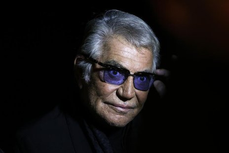 Italian designer Roberto Cavalli poses before the start of his Spring/Summer 2014 collection during Milan Fashion Week September 21, 2013. R Italian designer Roberto Cavalli poses before the start of his Spring/Summer 2014 collection during Milan Fashion Week September 21, 2013. R