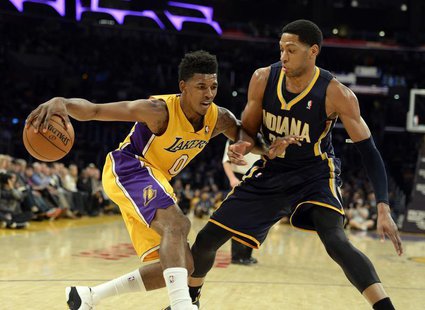 Jan 28, 2014; Los Angeles, CA, USA; Los Angeles Lakers small forward Nick Young (0) controls the ball against Indiana Pacers small forward D Jan 28, 2014; Los Angeles, CA, USA; Los Angeles Lakers small forward Nick Young (0) controls the ball against Indiana Pacers small forward D