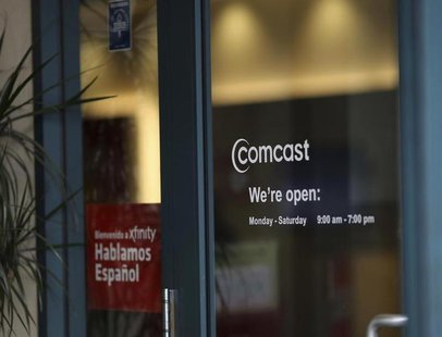 A Comcast sign is shown on the entrance to its store in San Francisco, California February 13, 2014. REUTERS/Robert Galbraith A Comcast sign is shown on the entrance to its store in San Francisco, California February 13, 2014. REUTERS/Robert Galbraith