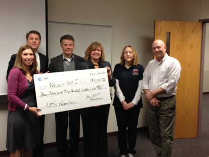 Members associated with LTC's Project GRILL receive the $4,500 check from the AT&T Foundation. Members associated with LTC's Project GRILL receive the $4,500 check from the AT&T Foundation.