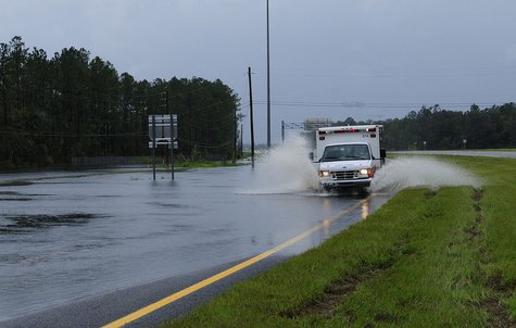 A flooded road. A flooded road.