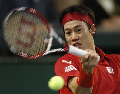 Japan's Kei Nishikori returns a shot against Canada's Frank Dancevic during their Davis Cup world group first round tennis match in Tokyo Fe Japan's Kei Nishikori returns a shot against Canada's Frank Dancevic during their Davis Cup world group first round tennis match in Tokyo Fe