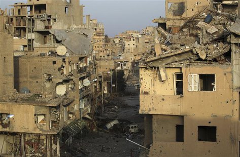A view shows damaged buildings in Deir al-Zor, eastern Syria February 19, 2014. Picture taken February 19, 2014. REUTERS/Khalil Ashawi A view shows damaged buildings in Deir al-Zor, eastern Syria February 19, 2014. Picture taken February 19, 2014. REUTERS/Khalil Ashawi