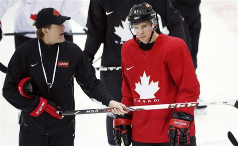 Canada's men's ice hockey team captain Sidney Crosby (R) listens to head coach Mike Babcock give directions during a team practice at the 20 Canada's men's ice hockey team captain Sidney Crosby (R) listens to head coach Mike Babcock give directions during a team practice at the 20