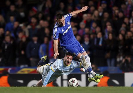 Chelsea's John Terry (R) challenges Steaua Bucharest's Pantelis Kapetanos during their Champions League soccer match at Stamford Bridge in L Chelsea's John Terry (R) challenges Steaua Bucharest's Pantelis Kapetanos during their Champions League soccer match at Stamford Bridge in L