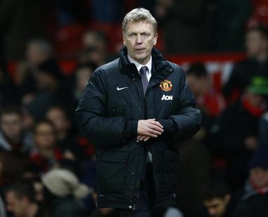 Manchester United manager David Moyes walks back to the dressing rooms after their English Premier League soccer match against Fulham at Old Manchester United manager David Moyes walks back to the dressing rooms after their English Premier League soccer match against Fulham at Old