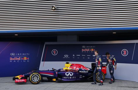 Red Bull Formula One drivers Sebastian Vettel (L) of Germany and Daniel Ricciardo of Australia walks after unveiling the new RB10 during the Red Bull Formula One drivers Sebastian Vettel (L) of Germany and Daniel Ricciardo of Australia walks after unveiling the new RB10 during the