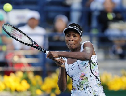 Venus Williams of the U.S. returns the ball to Caroline Wozniacki of Denmark during their women's singles semi-final match at the WTA Dubai Venus Williams of the U.S. returns the ball to Caroline Wozniacki of Denmark during their women's singles semi-final match at the WTA Dubai
