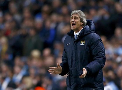 Manchester City's manager Manuel Pellegrini reacts during their Champions League round of 16 first leg soccer match against Barcelona at the Manchester City's manager Manuel Pellegrini reacts during their Champions League round of 16 first leg soccer match against Barcelona at the