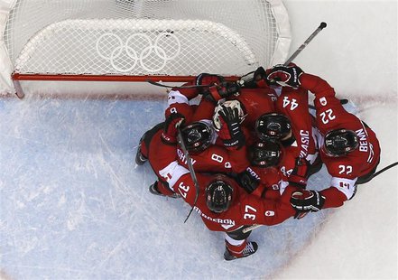 Canada's players congratulate goalie Carey Price after Canada defeated Team USA in their men's ice hockey semi-final game at the Sochi 2014 Canada's players congratulate goalie Carey Price after Canada defeated Team USA in their men's ice hockey semi-final game at the Sochi 2014