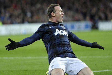 Manchester United's Wayne Rooney celebrates scoring a goal against Cardiff City during their English Premier League soccer match at Cardiff Manchester United's Wayne Rooney celebrates scoring a goal against Cardiff City during their English Premier League soccer match at Cardiff