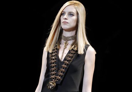 A model presents a creation from the Versace Autumn/Winter 2014 collection during Milan Fashion Week February 21, 2014. REUTERS/Alessandro G A model presents a creation from the Versace Autumn/Winter 2014 collection during Milan Fashion Week February 21, 2014. REUTERS/Alessandro G