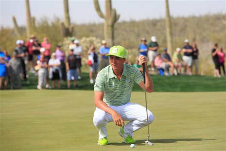 Feb 21, 2014; Marana, AZ, USA; Rickie Fowler speaks with Sergio Garcia (not shown) on the green of the seventh hole. The players agreed to g Feb 21, 2014; Marana, AZ, USA; Rickie Fowler speaks with Sergio Garcia (not shown) on the green of the seventh hole. The players agreed to g