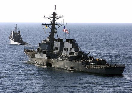 The U.S. Navy destroyer USS Cole (DDG 67) is towed away from the port city of Aden, Yemen, into open sea by the Military Sealift Command oce The U.S. Navy destroyer USS Cole (DDG 67) is towed away from the port city of Aden, Yemen, into open sea by the Military Sealift Command oce