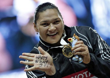 Winner Valerie Adams of New Zealand shows her gold medal at the victory ceremony for the women's shot put final during the IAAF World Athlet Winner Valerie Adams of New Zealand shows her gold medal at the victory ceremony for the women's shot put final during the IAAF World Athlet