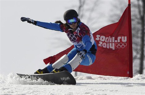 Austria's Julia Dujmovits competes during the women's parallel slalom snowboard finals at the 2014 Sochi Winter Olympic Games in Rosa Khutor Austria's Julia Dujmovits competes during the women's parallel slalom snowboard finals at the 2014 Sochi Winter Olympic Games in Rosa Khutor