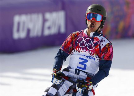 Russia's Vic Wild reacts during the men's parallel slalom snowboard finals at the 2014 Sochi Winter Olympic Games in Rosa Khutor February 22 Russia's Vic Wild reacts during the men's parallel slalom snowboard finals at the 2014 Sochi Winter Olympic Games in Rosa Khutor February 22