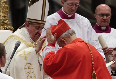 Pope Francis blesses newly elected cardinal Lorenzo Baldisseri of Italy during a consistory ceremony in Saint Peter's Basilica at the Vatica Pope Francis blesses newly elected cardinal Lorenzo Baldisseri of Italy during a consistory ceremony in Saint Peter's Basilica at the Vatica