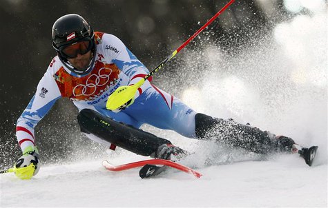 Austria's Mario Matt clears a gate during the first run of the men's alpine skiing slalom event at the 2014 Sochi Winter Olympics at the Ros Austria's Mario Matt clears a gate during the first run of the men's alpine skiing slalom event at the 2014 Sochi Winter Olympics at the Ros