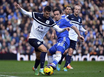 Chelsea's Frank Lampard (R) challenges Everton's Kevin Mirallas during their English Premier League soccer match at Stamford Bridge in Londo Chelsea's Frank Lampard (R) challenges Everton's Kevin Mirallas during their English Premier League soccer match at Stamford Bridge in Londo