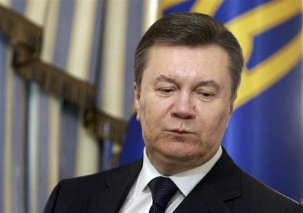Ukraine's President Viktor Yanukovich looks on during a signing ceremony of an EU-mediated peace deal with opposition leaders at the preside Ukraine's President Viktor Yanukovich looks on during a signing ceremony of an EU-mediated peace deal with opposition leaders at the preside