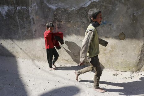 Children react after losing their mother in what activists said where explosive barrels thrown by forces loyal to Syrian President Bashar al Children react after losing their mother in what activists said where explosive barrels thrown by forces loyal to Syrian President Bashar al