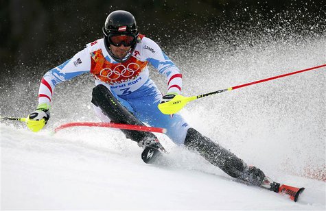 Austria's Mario Matt clears a gate during the first run of the men's alpine skiing slalom event at the 2014 Sochi Winter Olympics at the Ros Austria's Mario Matt clears a gate during the first run of the men's alpine skiing slalom event at the 2014 Sochi Winter Olympics at the Ros