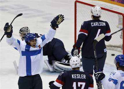 Finland's Teemu Selanne (L) celebrates his goal as Team USA's Ryan Kesler and John Carlson react during the third period of their men's ice Finland's Teemu Selanne (L) celebrates his goal as Team USA's Ryan Kesler and John Carlson react during the third period of their men's ice
