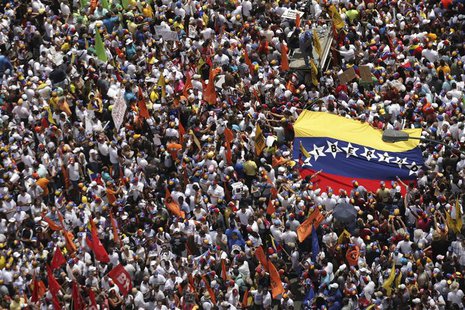 Opposition supporters march protest against Nicolas Maduro's government in Caracas February 22, 2014. REUTERS/Christian Veron Opposition supporters march protest against Nicolas Maduro's government in Caracas February 22, 2014. REUTERS/Christian Veron