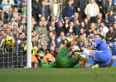 Chelsea's John Terry (R) reacts as Everton's Tim Howard (L) scores an own goal during their English Premier League soccer match at Stamford Chelsea's John Terry (R) reacts as Everton's Tim Howard (L) scores an own goal during their English Premier League soccer match at Stamford