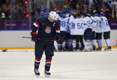 Team USA's Zach Parise skates away as Finland celebrates their win in their men's ice hockey bronze medal game at the Sochi 2014 Winter Olym Team USA's Zach Parise skates away as Finland celebrates their win in their men's ice hockey bronze medal game at the Sochi 2014 Winter Olym