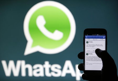 A Whatsapp App logo is seen behind a Samsung Galaxy S4 phone that is logged on to Facebook in the central Bosnian town of Zenica, February 2 A Whatsapp App logo is seen behind a Samsung Galaxy S4 phone that is logged on to Facebook in the central Bosnian town of Zenica, February 2