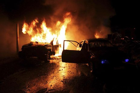Cars burn at the site of an explosion in the Shi'ite town of Hermel February 22, 2014. REUTERS/Rami Bleibel Cars burn at the site of an explosion in the Shi'ite town of Hermel February 22, 2014. REUTERS/Rami Bleibel
