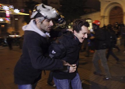 Plain clothes police officers detain a demonstrator during a protest against a new law tightening control of the Internet in Istanbul Februa Plain clothes police officers detain a demonstrator during a protest against a new law tightening control of the Internet in Istanbul Februa