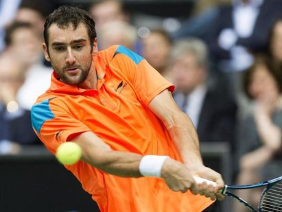 Marin Cilic of Croatia hits a backhand against Tomas Berdych of Czech Republic during their final match the ABN AMRO tennis tournament in Ro Marin Cilic of Croatia hits a backhand against Tomas Berdych of Czech Republic during their final match the ABN AMRO tennis tournament in Ro