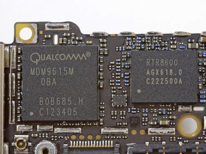 Handout image released by iFixit.com shows the Qualcomm MDM9615M chip on a board of a new iPhone 5 in Melbourne, Australia September 21, 201 Handout image released by iFixit.com shows the Qualcomm MDM9615M chip on a board of a new iPhone 5 in Melbourne, Australia September 21, 201