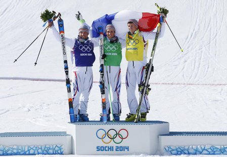 From L-R: Second-placed France's Arnaud Bovolenta poses with compatriots winner Jean Frederic Chapuis and third-placed Jonathan Midol on the From L-R: Second-placed France's Arnaud Bovolenta poses with compatriots winner Jean Frederic Chapuis and third-placed Jonathan Midol on the