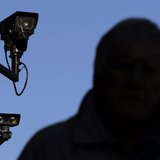 A security camera overlooks a man as he walks down a street in London November 2, 2006. REUTERS/Luke MacGregor A security camera overlooks a man as he walks down a street in London November 2, 2006. REUTERS/Luke MacGregor