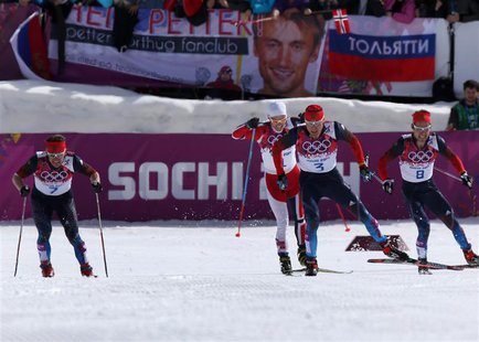Russia's Alexander Legkov (2nd R) Maxim Vylegzhanin (L) and Ilia Chernousov (R) race to the finish line to take first, second and third plac Russia's Alexander Legkov (2nd R) Maxim Vylegzhanin (L) and Ilia Chernousov (R) race to the finish line to take first, second and third plac