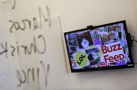 A television monitor displaying BuzzFeed is seen inside one of their office rooms in New York February 19, 2013. REUTERS/Shannon Stapleton A television monitor displaying BuzzFeed is seen inside one of their office rooms in New York February 19, 2013. REUTERS/Shannon Stapleton
