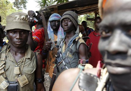 Fighters from the Christian "anti-balaka" militia stand at the headquarters in the northern Bangui suburb of Boeing, an area near the Mpoko Fighters from the Christian "anti-balaka" militia stand at the headquarters in the northern Bangui suburb of Boeing, an area near the Mpoko