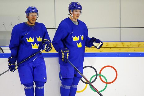 Sweden's Daniel Alfredsson (L) and Nicklas Backstrom participate in a men's ice hockey team practice at the 2014 Sochi Winter Olympics Febru Sweden's Daniel Alfredsson (L) and Nicklas Backstrom participate in a men's ice hockey team practice at the 2014 Sochi Winter Olympics Febru
