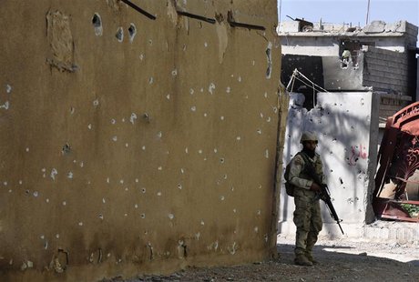 A member of the Iraqi security forces patrols with his weapon in Sulaiman Pek, 160 km (99 miles) north of Baghdad, February 21, 2014. REUTER A member of the Iraqi security forces patrols with his weapon in Sulaiman Pek, 160 km (99 miles) north of Baghdad, February 21, 2014. REUTER